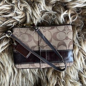 Brown tone COACH clutch wristlet